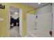 Full bathroom featuring a tub with shelves and a hallway and closet in view at 320 Legacy Blvd, Greenwood, IN 46143