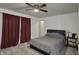 Comfortable bedroom with ceiling fan, closet, and neutral walls and carpet at 320 Legacy Blvd, Greenwood, IN 46143