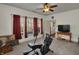 Bright bedroom with carpet, a ceiling fan, natural light, and a television at 320 Legacy Blvd, Greenwood, IN 46143