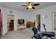 Well-lit bedroom with carpet, a ceiling fan, and multiple doorways at 320 Legacy Blvd, Greenwood, IN 46143