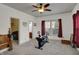 Spacious bedroom with carpet, a ceiling fan, and views of the exterior at 320 Legacy Blvd, Greenwood, IN 46143