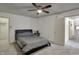 Cozy bedroom featuring neutral carpet, ceiling fan, and ensuite access at 320 Legacy Blvd, Greenwood, IN 46143