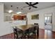 Eat-in kitchen and dining area features modern lighting, seating, and wood flooring at 320 Legacy Blvd, Greenwood, IN 46143