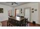 Bright dining room boasts a wooden table, bench, and backyard access door at 320 Legacy Blvd, Greenwood, IN 46143