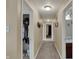 Long hallway view leading to bedrooms and bathrooms, enhanced by warm lighting at 320 Legacy Blvd, Greenwood, IN 46143