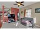 Comfortable living room featuring a plush sofa, a TV, and a large window at 320 Legacy Blvd, Greenwood, IN 46143
