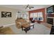 Comfortable living room with neutral tones, a fireplace, and a view into the dining area at 320 Legacy Blvd, Greenwood, IN 46143