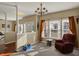 Cozy living room with a fireplace, comfortable seating, and large windows at 320 Legacy Blvd, Greenwood, IN 46143