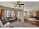 Spacious living room featuring hardwood flooring, plush sofas, and ample natural light at 320 Legacy Blvd, Greenwood, IN 46143
