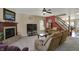 Living room with fireplace, large-screen television, comfortable seating, and wood flooring at 320 Legacy Blvd, Greenwood, IN 46143