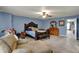 Relaxing main bedroom with a ceiling fan, brown furniture and a doorway to another bedroom at 320 Legacy Blvd, Greenwood, IN 46143
