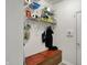 Bright mudroom featuring a wooden bench with hooks and wire shelving storage above at 320 Legacy Blvd, Greenwood, IN 46143