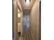 Hallway displaying consistent flooring, with a view into the bathroom and bedrooms at , Indianapolis, IN 46221