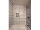 Shower featuring a tiled wall surround and a shower head, a modern design at , Indianapolis, IN 46221