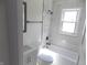 Stylish bathroom featuring marble tile shower, modern fixtures, and a sleek vanity at 3323 E 36Th St, Indianapolis, IN 46218
