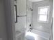 Stylish bathroom featuring marble tile shower, modern fixtures, and a sleek vanity at 3323 E 36Th St, Indianapolis, IN 46218