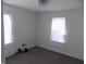 Bright bedroom featuring modern flooring and two windows that provide natural light at 3323 E 36Th St, Indianapolis, IN 46218