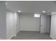 A bright bedroom showcasing modern gray wood floors and recessed lighting at 3323 E 36Th St, Indianapolis, IN 46218