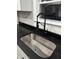 Modern kitchen sink with sleek black faucet and granite counter tops at 3323 E 36Th St, Indianapolis, IN 46218