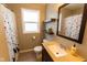 Well-lit bathroom features a shower, floating shelves, and a vanity sink at 3420 N Chester Ave, Indianapolis, IN 46218