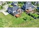 Backyard featuring a manicured lawn, spacious patio, and well-maintained landscaping at 3715 Kendall Wood Dr, Carmel, IN 46032