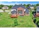 Beautiful backyard featuring a manicured lawn, spacious patio, and well-maintained landscaping at 3715 Kendall Wood Dr, Carmel, IN 46032