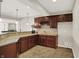 Basement wet bar with granite countertops, wine rack, and sink in this home's finished basement at 3715 Kendall Wood Dr, Carmel, IN 46032