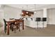 This basement bar has dark wood cabinets, granite countertop and bar seating for fun entertaining at 3715 Kendall Wood Dr, Carmel, IN 46032