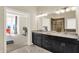 Spacious bathroom with a double vanity, granite countertop, and a view of the bedroom at 3715 Kendall Wood Dr, Carmel, IN 46032