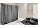 The bathroom features a modern gray shower curtain and stylish vanity with sleek countertops at 3715 Kendall Wood Dr, Carmel, IN 46032