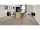 This bonus room features plush carpeting, natural light, and a functional work area at 3715 Kendall Wood Dr, Carmel, IN 46032