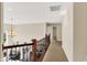 Upper hallway with wood banister overlooking the living area; features neutral tones and recessed lighting at 3715 Kendall Wood Dr, Carmel, IN 46032