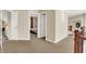 Second floor hallway with bedroom access and wooden banister overlooking the foyer at 3715 Kendall Wood Dr, Carmel, IN 46032