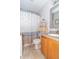 Cozy bathroom with granite vanity and shower with patterned curtain at 377 Van Buren St, Greenfield, IN 46140