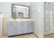 Updated bathroom with a large vanity and mirror, along with a shower and tub at 377 Van Buren St, Greenfield, IN 46140