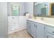 Accessible bathroom featuring a walk-in tub, vanity, and ample cabinet space at 377 Van Buren St, Greenfield, IN 46140