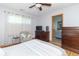 Bright bedroom featuring hardwood floors, natural light, and an ensuite bathroom at 377 Van Buren St, Greenfield, IN 46140