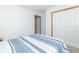 Bright bedroom with closet space and light blue patterned comforter at 377 Van Buren St, Greenfield, IN 46140