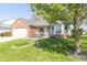 Well-maintained single Gathering home featuring green grass, a flower bed, and front-facing windows at 377 Van Buren St, Greenfield, IN 46140
