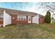 Private brick backyard featuring a small patio and a grassy area ready for entertaining at 3818 Gray Pond Ct, Indianapolis, IN 46237