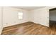 Bedroom with wood flooring, a window, and closet for convenient storage at 3818 Gray Pond Ct, Indianapolis, IN 46237