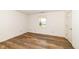 A bedroom features wood floors, a window, and ample natural light at 3818 Gray Pond Ct, Indianapolis, IN 46237