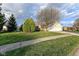 Charming home with manicured lawn and mature trees, adding to the curb appeal at 3818 Gray Pond Ct, Indianapolis, IN 46237