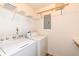 Laundry room equipped with a washer, a dryer, and a shelf at 3818 Gray Pond Ct, Indianapolis, IN 46237