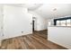 Bright living room featuring vaulted ceilings, wood flooring, and natural light at 3818 Gray Pond Ct, Indianapolis, IN 46237