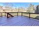 Spacious wooden back deck with dark brown railings and room for outdoor seating at 3926 Castle Rock Dr, Zionsville, IN 46077