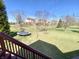 Spacious backyard with a trampoline, waterfall feature and mature trees at 3926 Castle Rock Dr, Zionsville, IN 46077