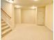 Basement area, featuring stairs and a door, providing ample storage and access to other parts of the home at 3926 Castle Rock Dr, Zionsville, IN 46077