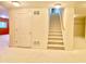 Finished basement with carpeted floor and staircase leading up, offering a versatile space for entertainment or relaxation at 3926 Castle Rock Dr, Zionsville, IN 46077