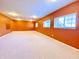 Bright finished basement with multiple windows and recessed lighting, ideal for a home theater or game room at 3926 Castle Rock Dr, Zionsville, IN 46077